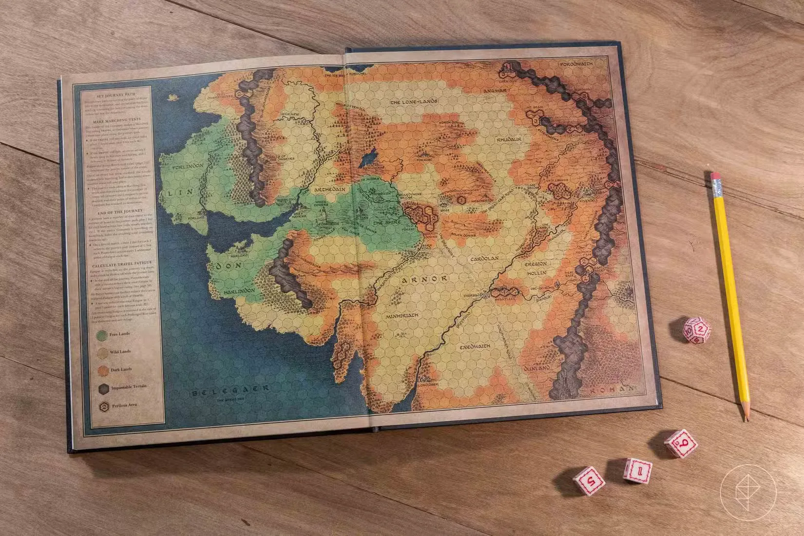 The rear flyleaf shows a similar map overlaid with a hex to mediate overland travel.