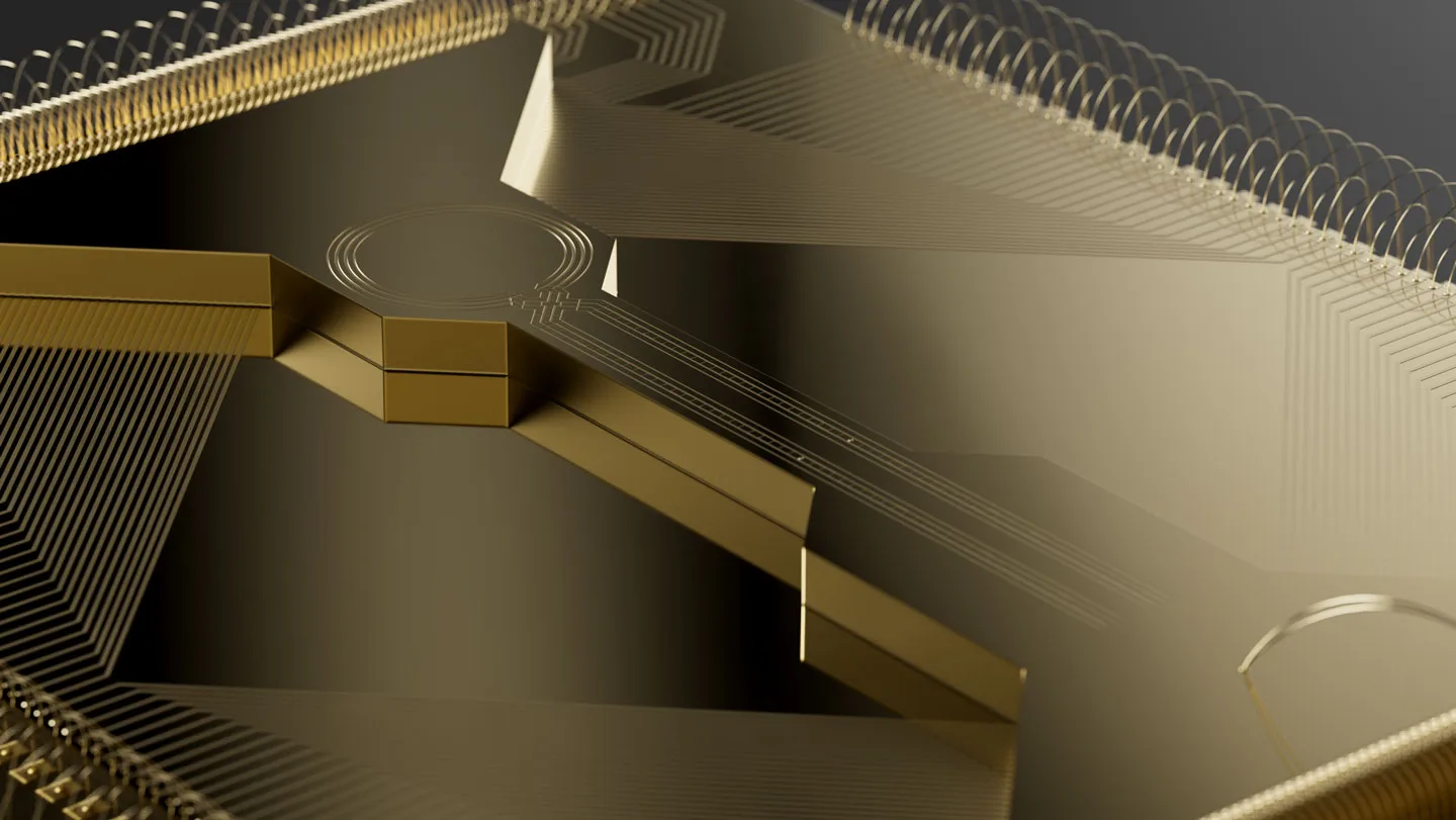 A close-up of a gold colored quantum computing chip.