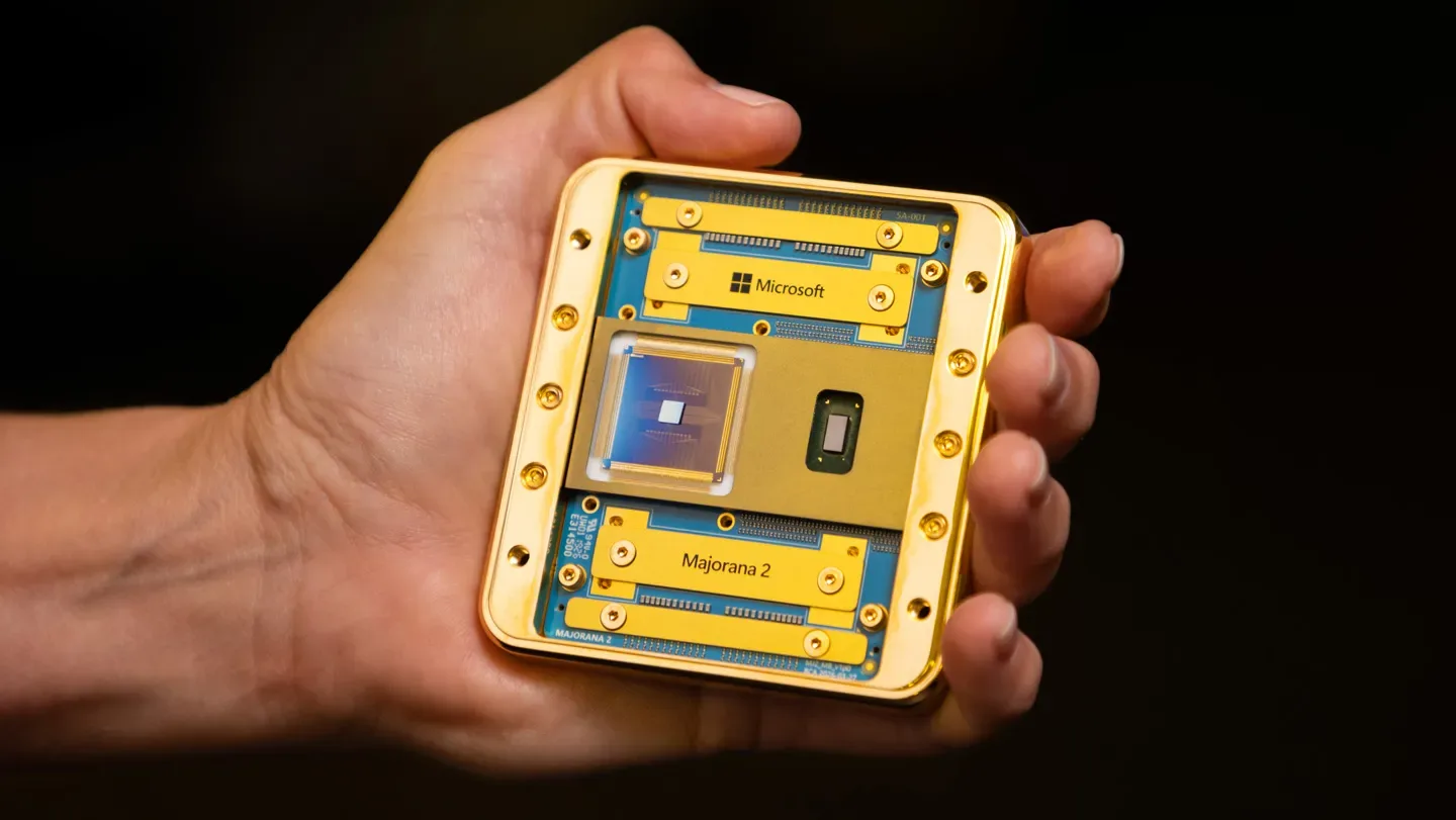 A hand holds a square quantum computing chip with the name Majorana 2 on it.